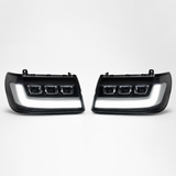 LandCruiser 100/105 Series bi-LED headlights — left and right pair on white background