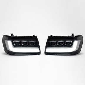 LandCruiser 100/105 Series bi-LED headlights — left and right pair on white background