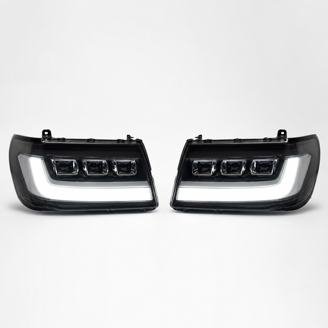 LandCruiser 100/105 Series bi-LED headlights — left and right pair on white background