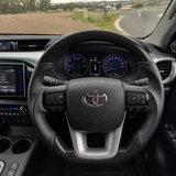 Carbon & Leather Flat-Bottom Steering Wheel for Toyota Hilux N80 & Fortuner (2015–2026) – Factory Fit Upgrade
