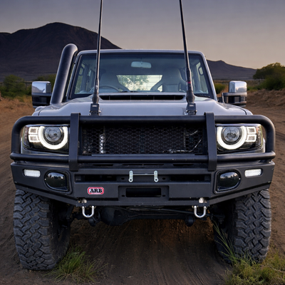 Bi-LED projector headlights for Toyota LandCruiser 70 Series — front assembly showing projector lens and DRL bar