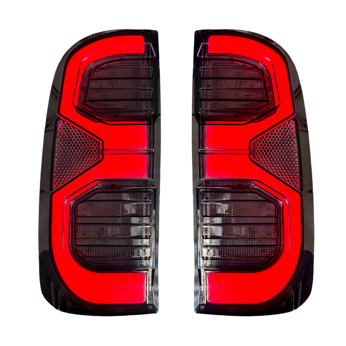 Hilux N70 angular multi-bar LED tail light close-up, lit