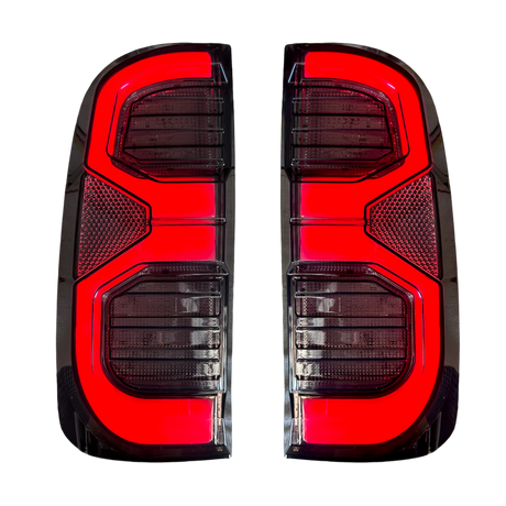 Hilux N70 angular multi-bar LED tail light close-up, lit
