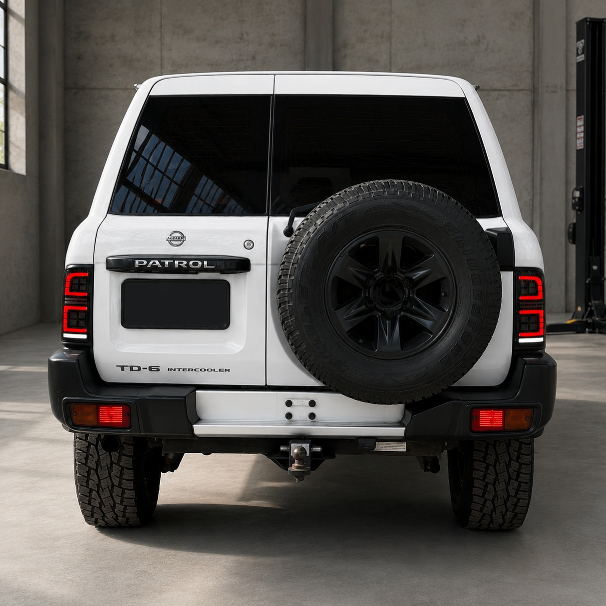 Rear three-quarter angle of Nissan GU Patrol Series 1-3 Wagon with smoked LED tail light upgrade