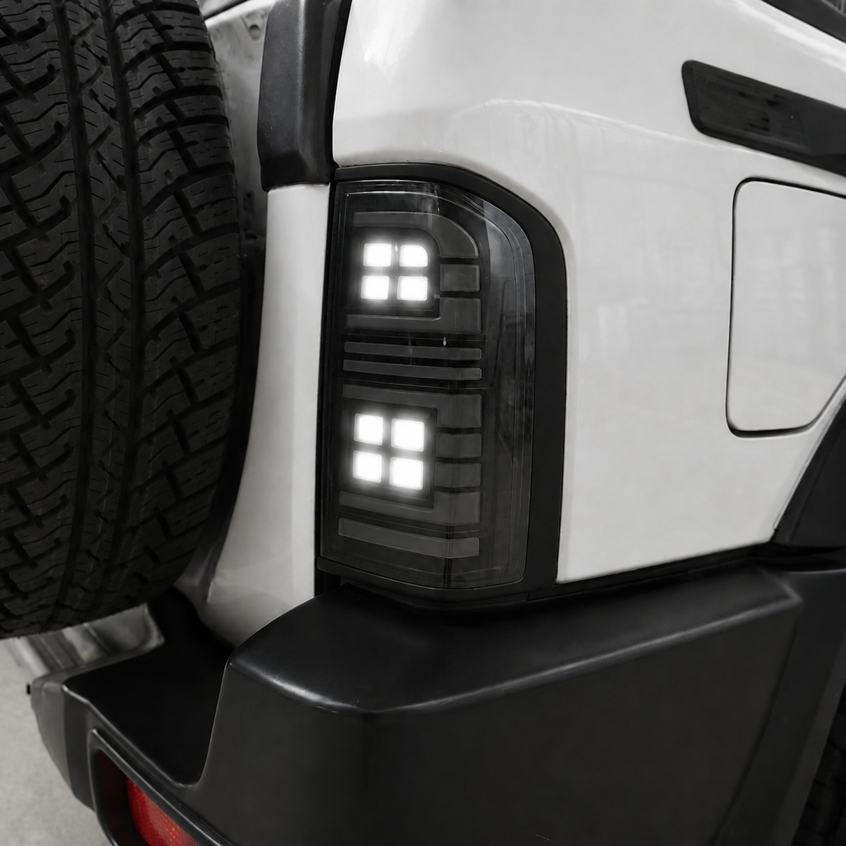 Close-up of Nissan GU Patrol Series 1-3 smoked LED tail light housing, unlit