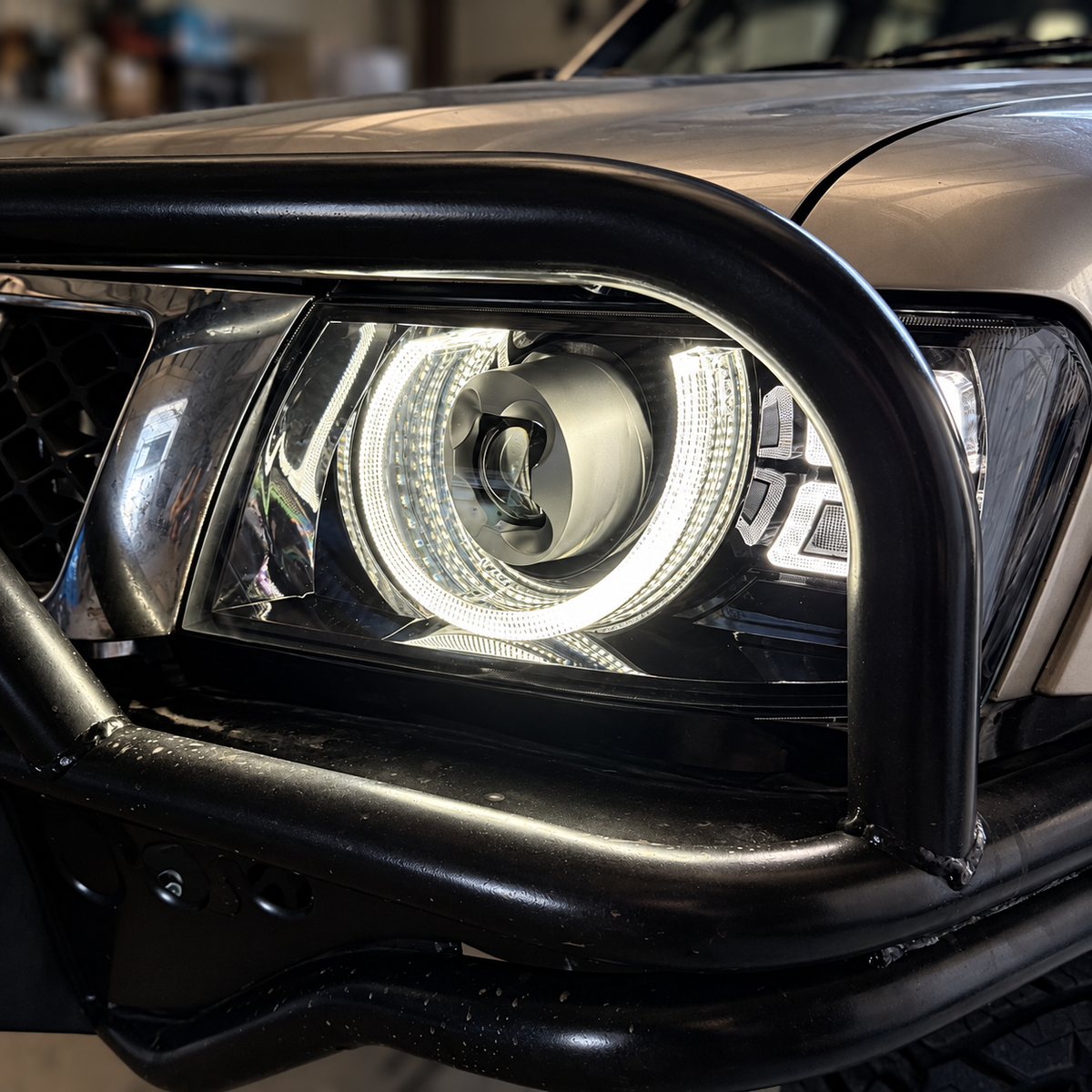 Nissan Patrol GU Y61 LED headlight installed behind bullbar
