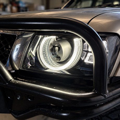 Nissan Patrol GU Y61 LED headlight installed behind bullbar