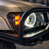 Nissan Patrol GU Y61 LED headlight with white DRL and amber indicators illuminated