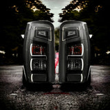 Smoked tail lights installed on Mitsubishi Triton MR, factory-style housing